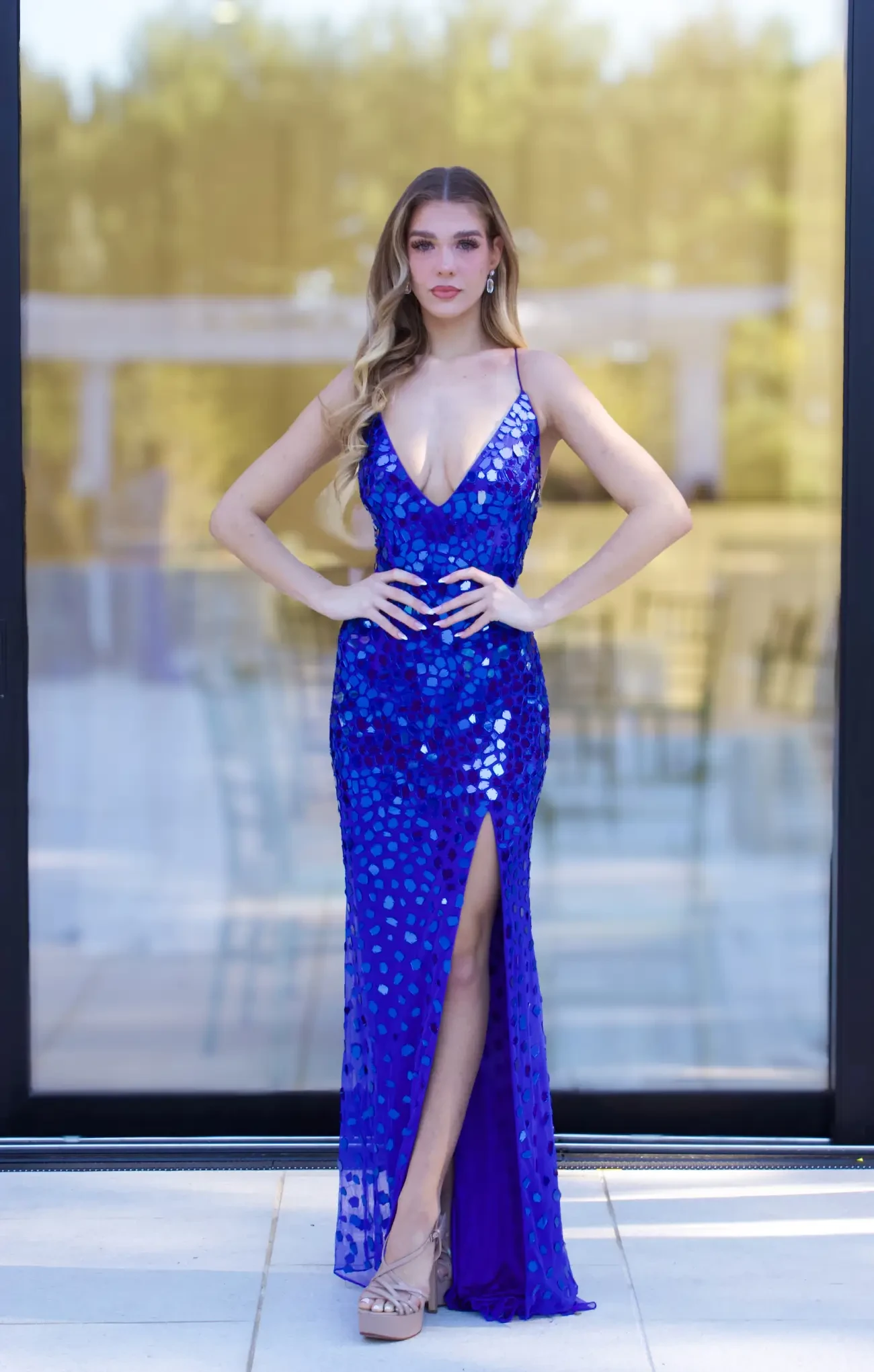 Model wearing a white prom dress