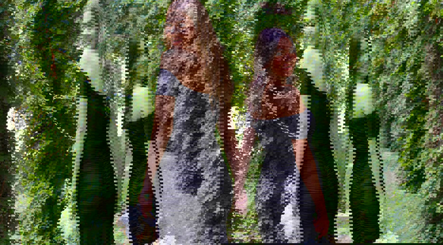 Models wearing a black dresses