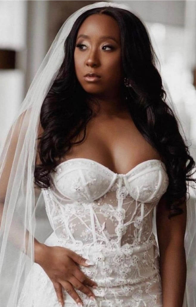 Model wearing a white gown